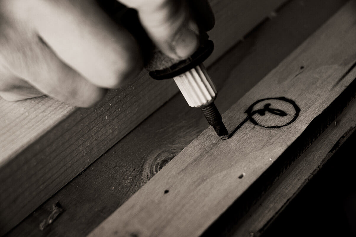 The frame is signed, by hand, on the back.