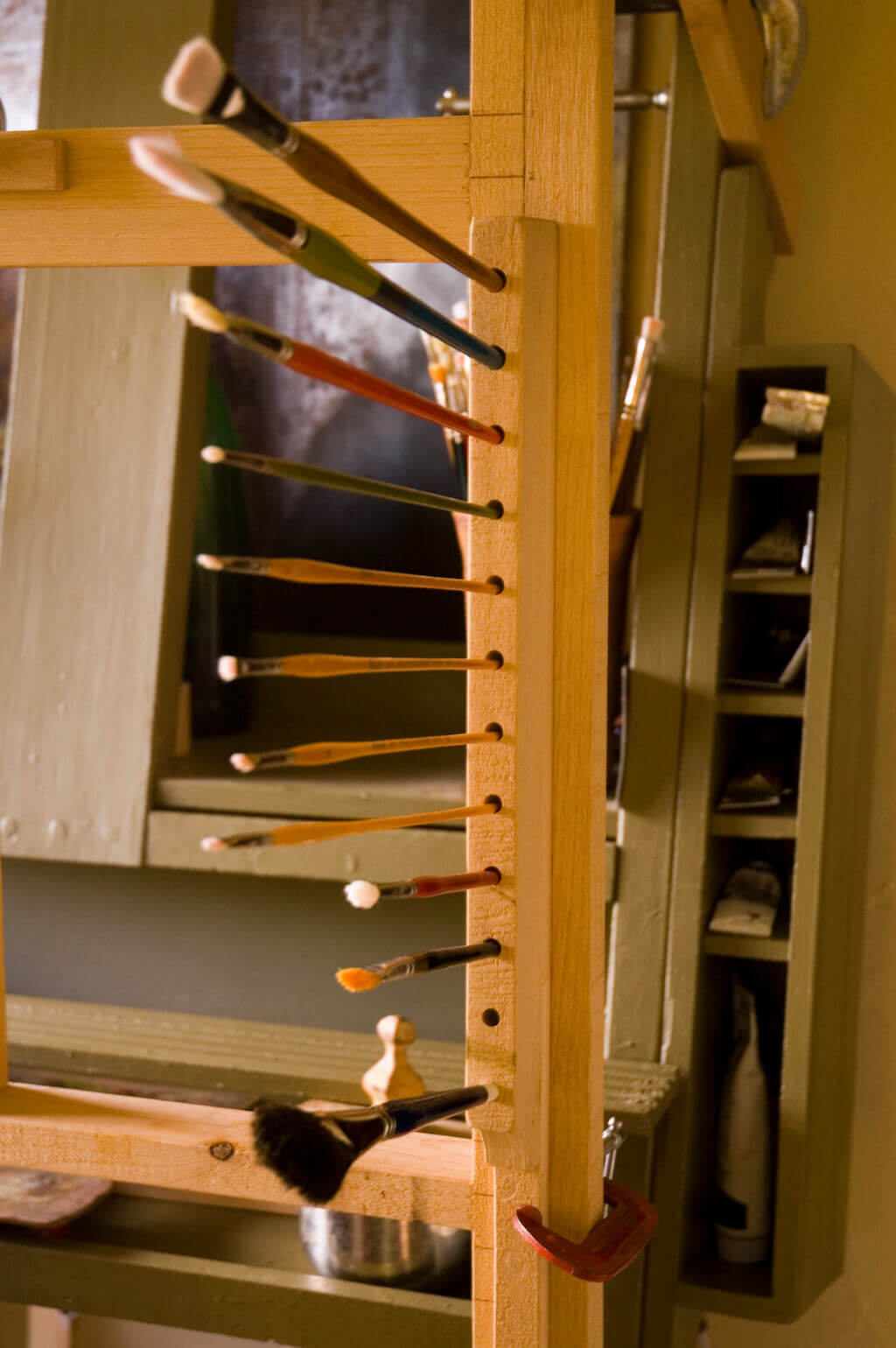 Cut from a piece of alder stock, holes for brushes are drilled into the wood at a slight angle so th...