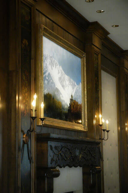 Den Kommende Vinteren, flanked by panels from Skjønnhet Underveis above one of the fireplaces in t...