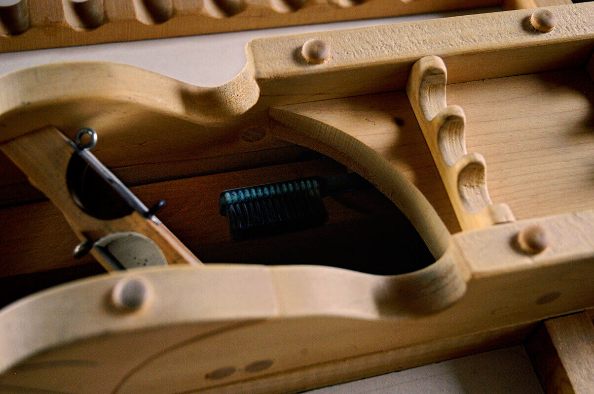 This view down into the wax-pencil sharpener shows the beveled edges of the trough for shavings, as ...