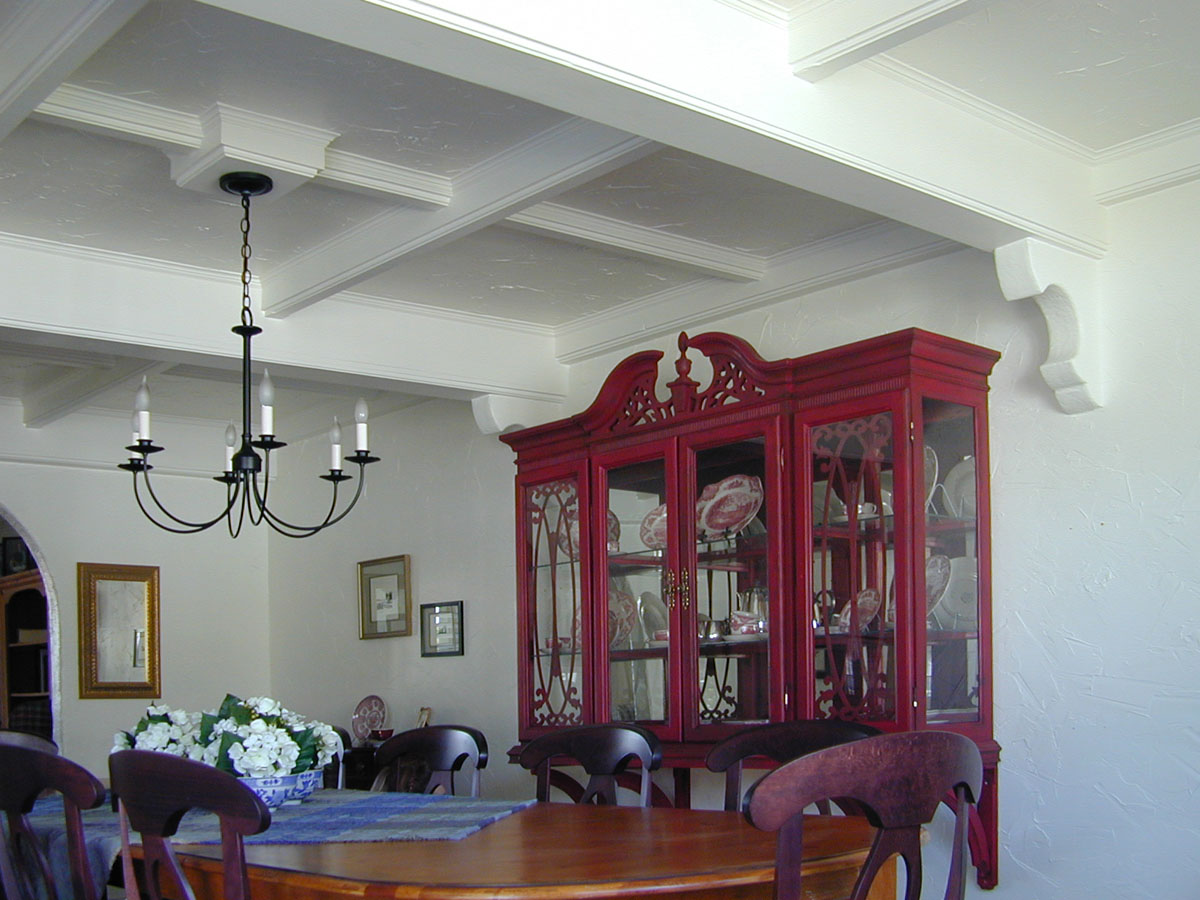 The remodeling of the upper half of a china closet is mounted to the wall and supported by corbels d...